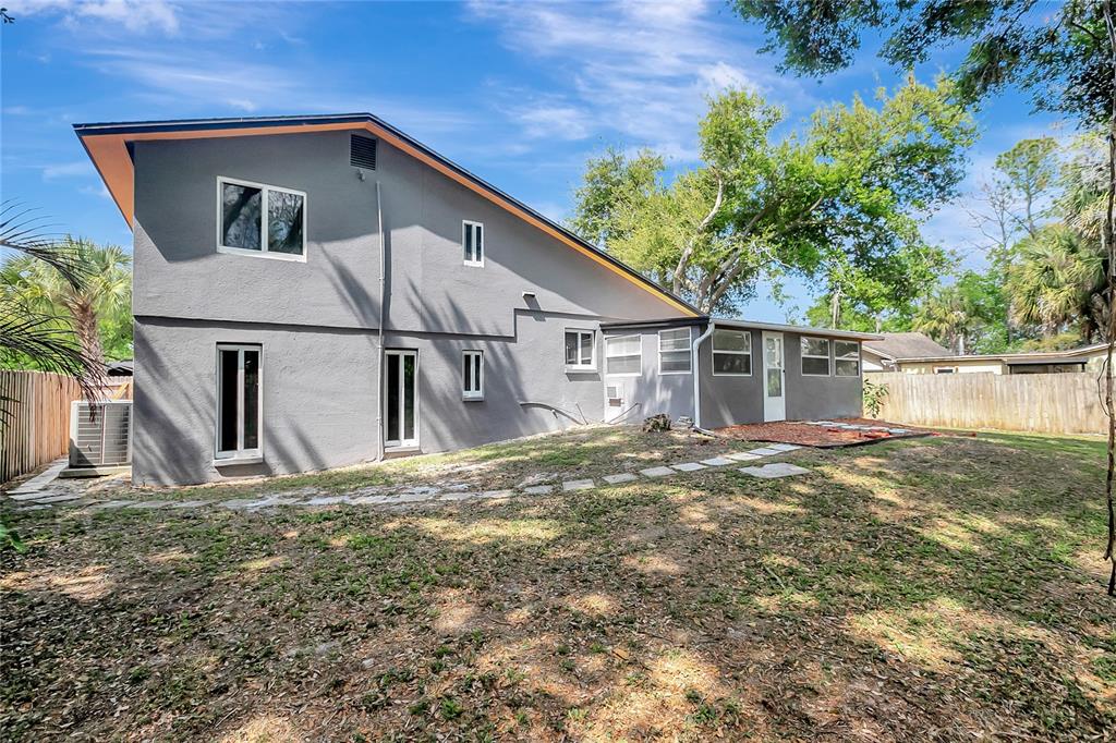 16133 Ravendale Drive Tampa, FL 33618 - Photo 40 of 46 a view of a house with a yard