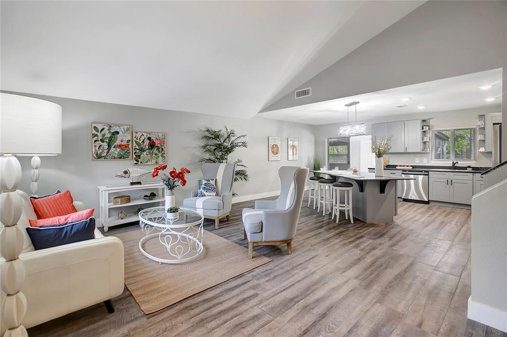 16133 Ravendale Drive Tampa, FL 33618 - Photo 5 of 46 a living room with furniture and a wooden floor