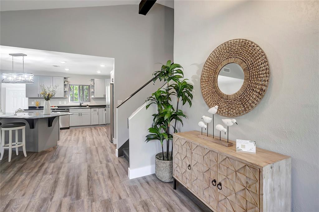 16133 Ravendale Drive Tampa, FL 33618 - Photo 6 of 46 a kitchen with granite countertop a white cabinets a sink and a stove