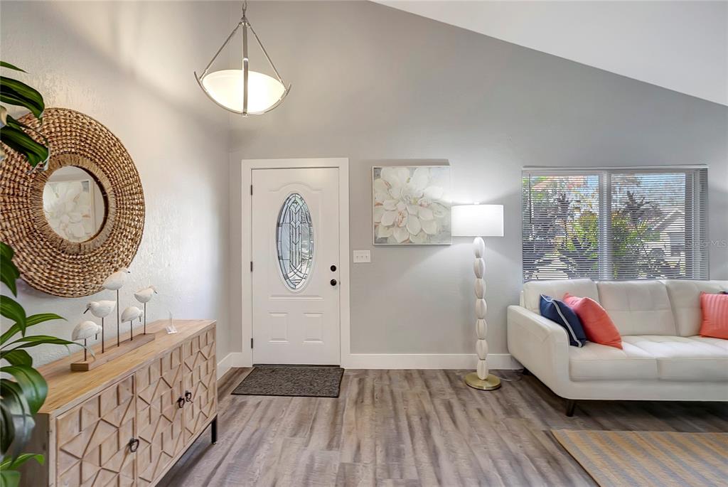 16133 Ravendale Drive Tampa, FL 33618 - Photo 9 of 46 a living room with furniture and a wooden floor