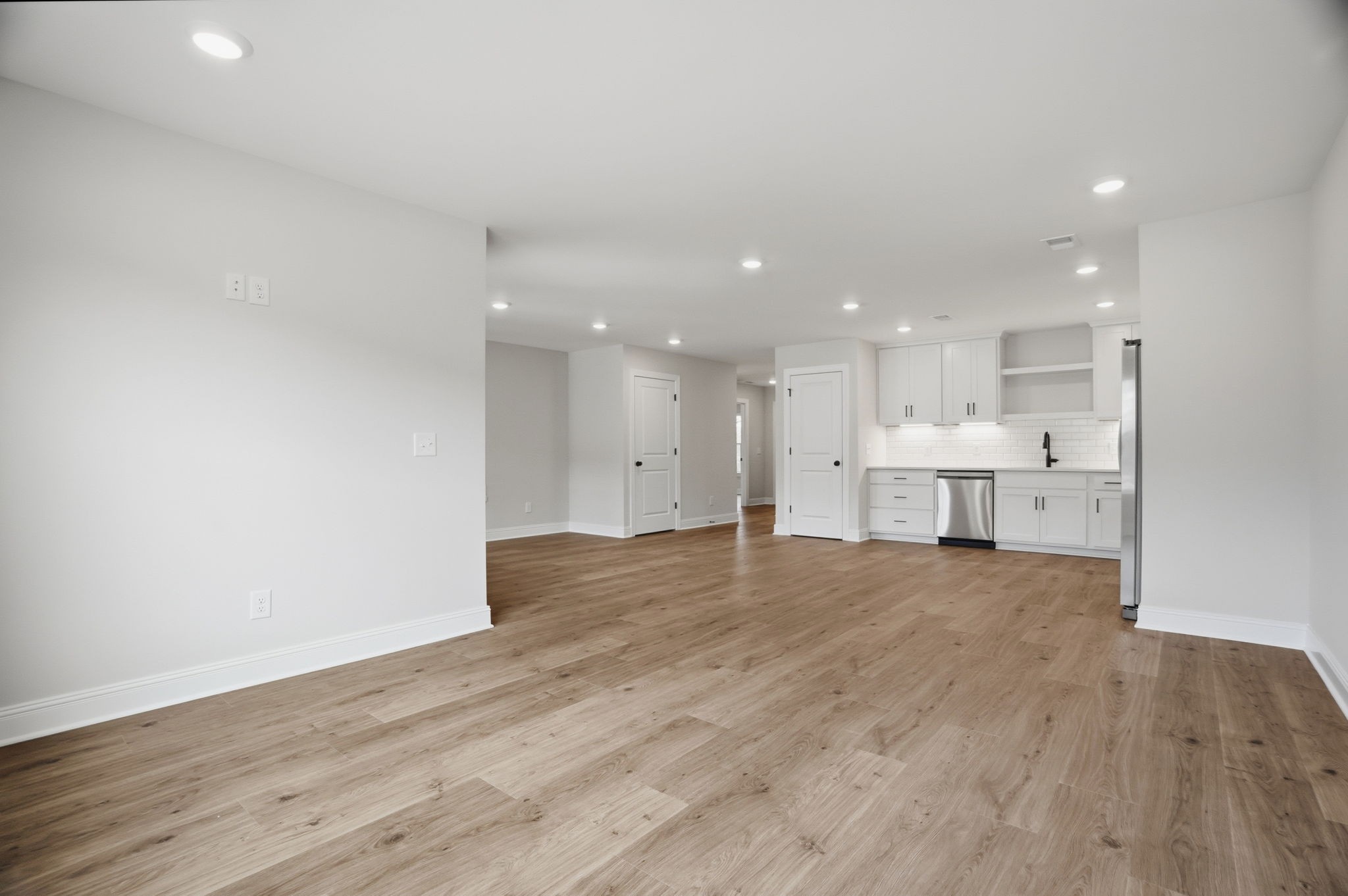 2139 Rylee Way, Unit 6 Greenbrier, TN 37073 - Photo 12 of 32 a view of kitchen with kitchen island wooden floor center island and stainless steel appliances