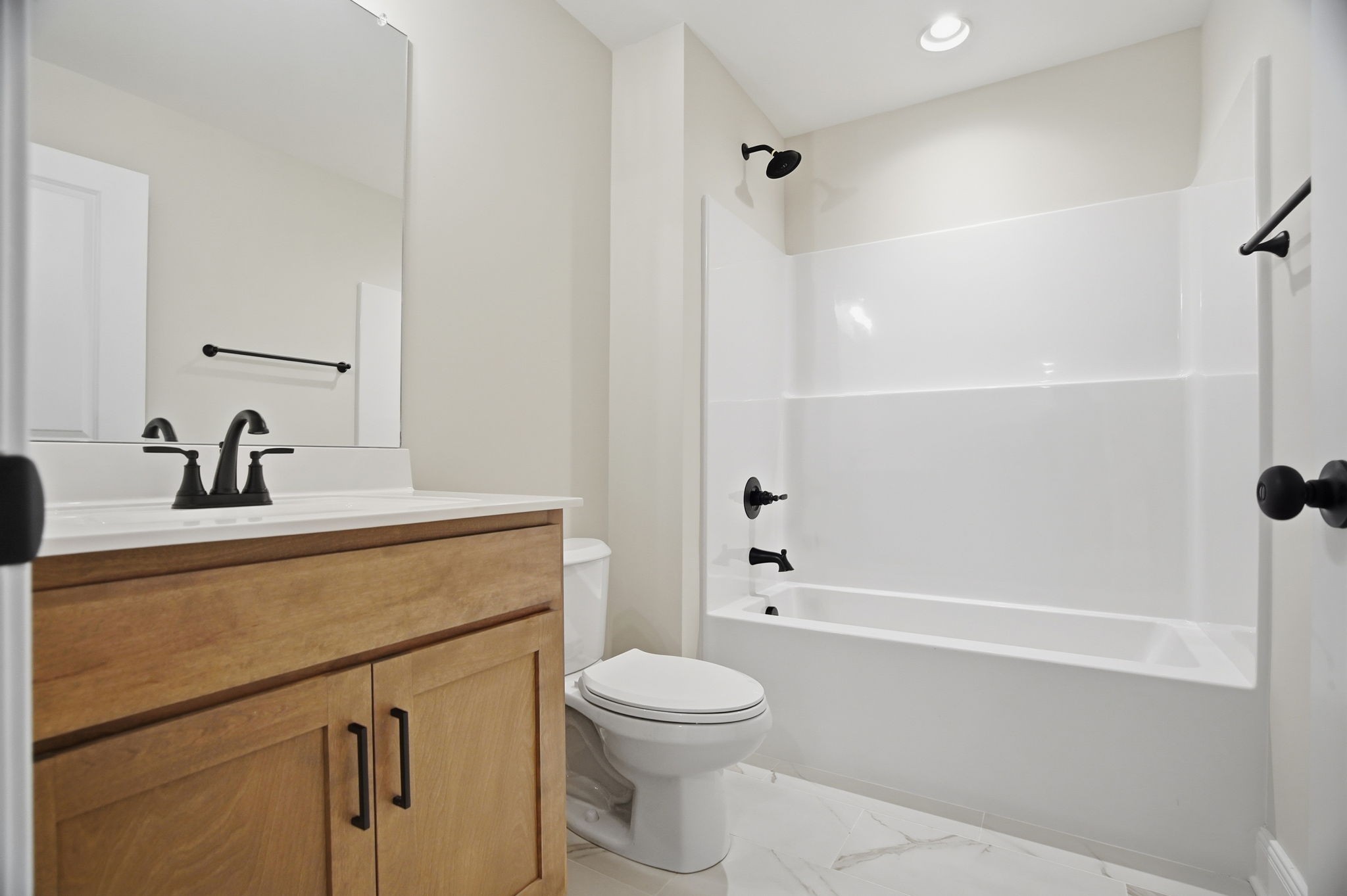 2139 Rylee Way, Unit 6 Greenbrier, TN 37073 - Photo 19 of 32 a bathroom with a sink a toilet and shower