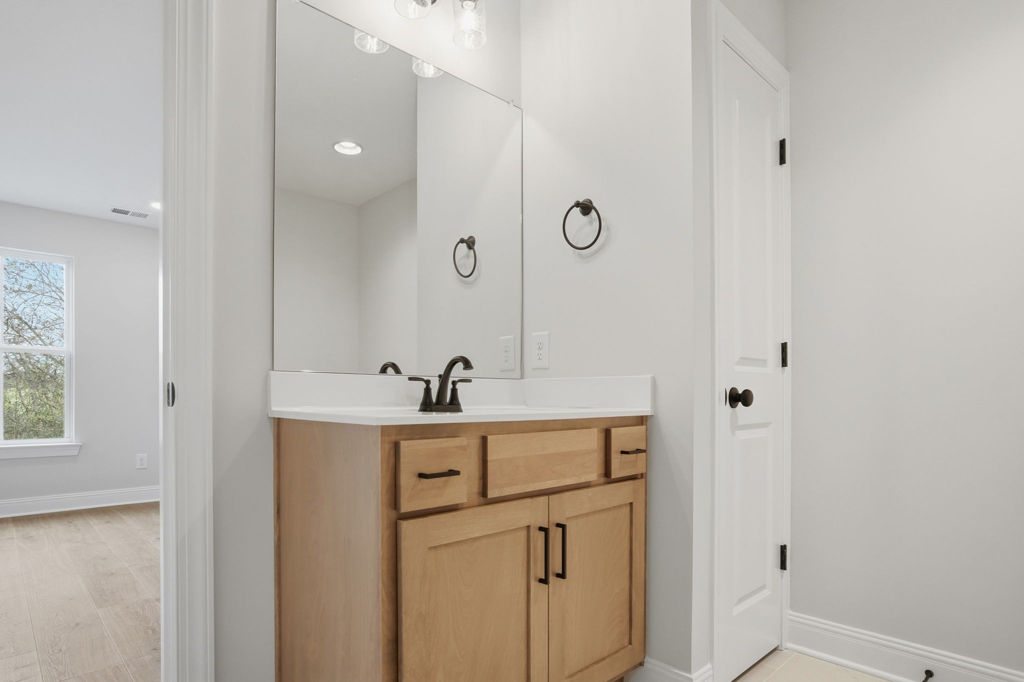 2139 Rylee Way, Unit 6 Greenbrier, TN 37073 - Photo 25 of 32 a bathroom with a sink and a mirror