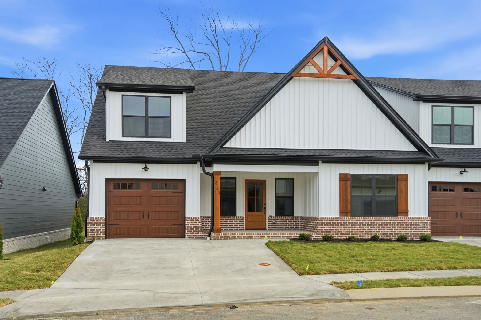 2139 Rylee Way, Unit 6 Greenbrier, TN 37073 - Photo 3 of 32 a front view of a house with a yard
