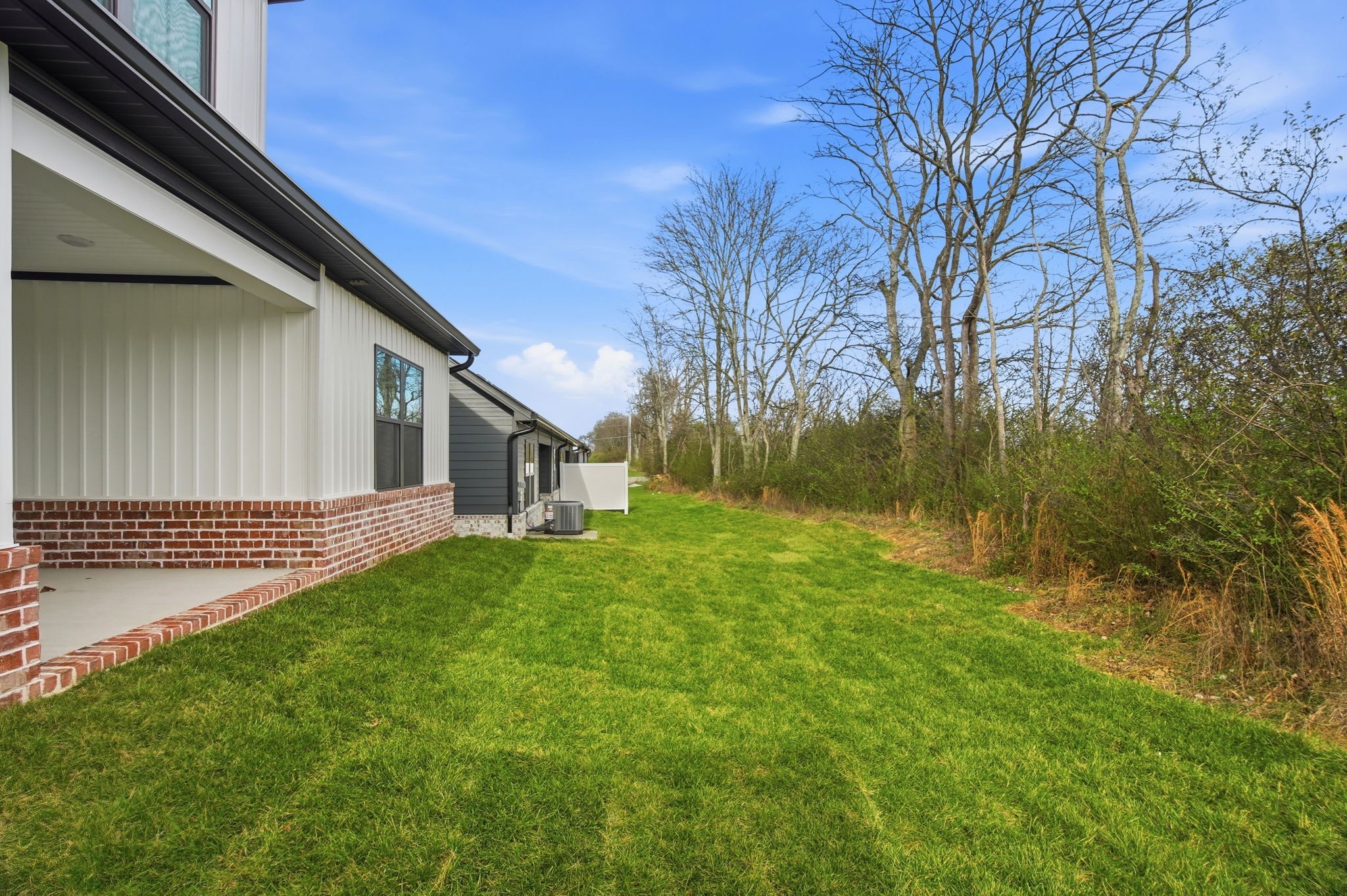 2139 Rylee Way, Unit 6 Greenbrier, TN 37073 - Photo 31 of 32 a view of a yard with a house