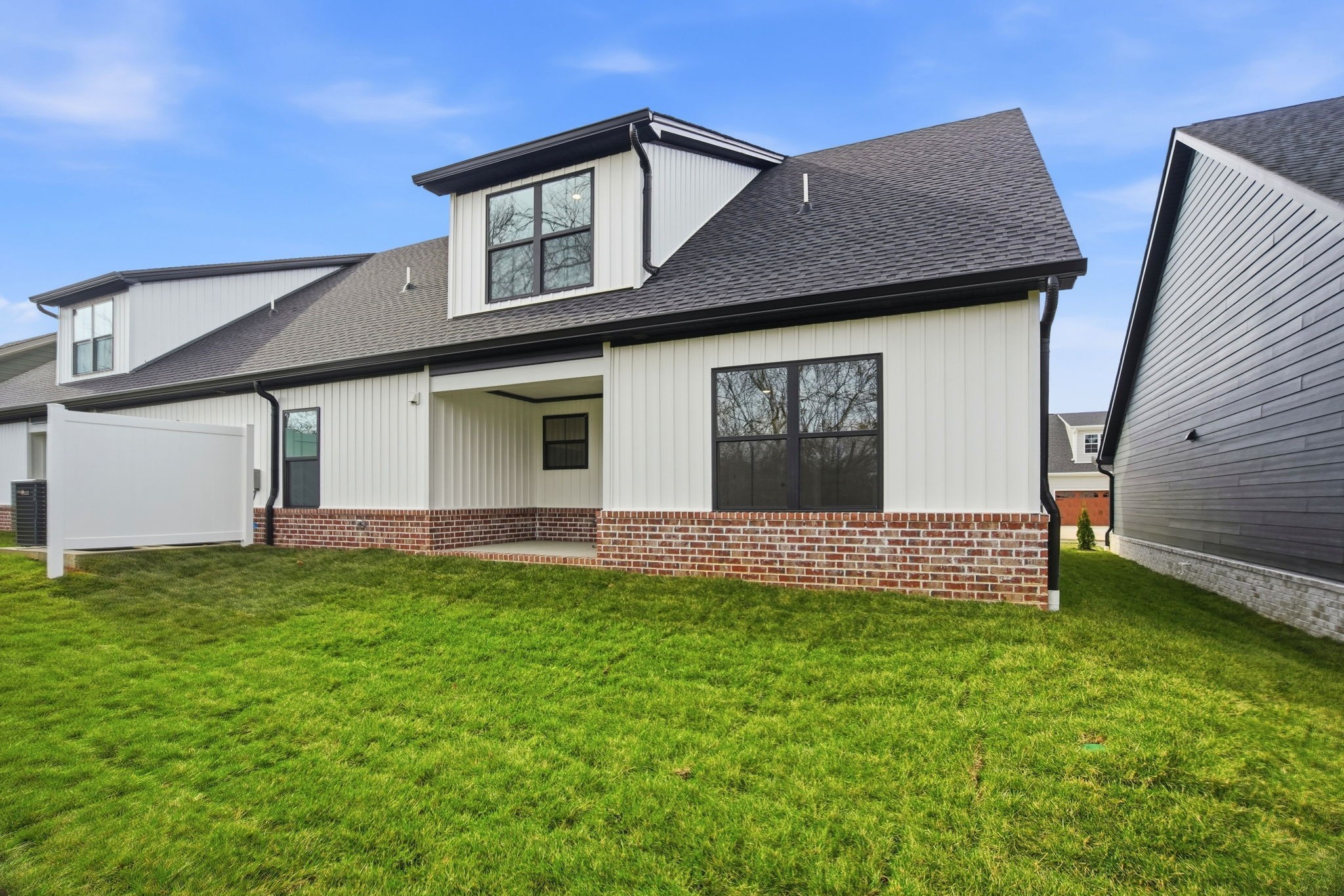 2139 Rylee Way, Unit 6 Greenbrier, TN 37073 - Photo 32 of 32 a front view of a house with a garden