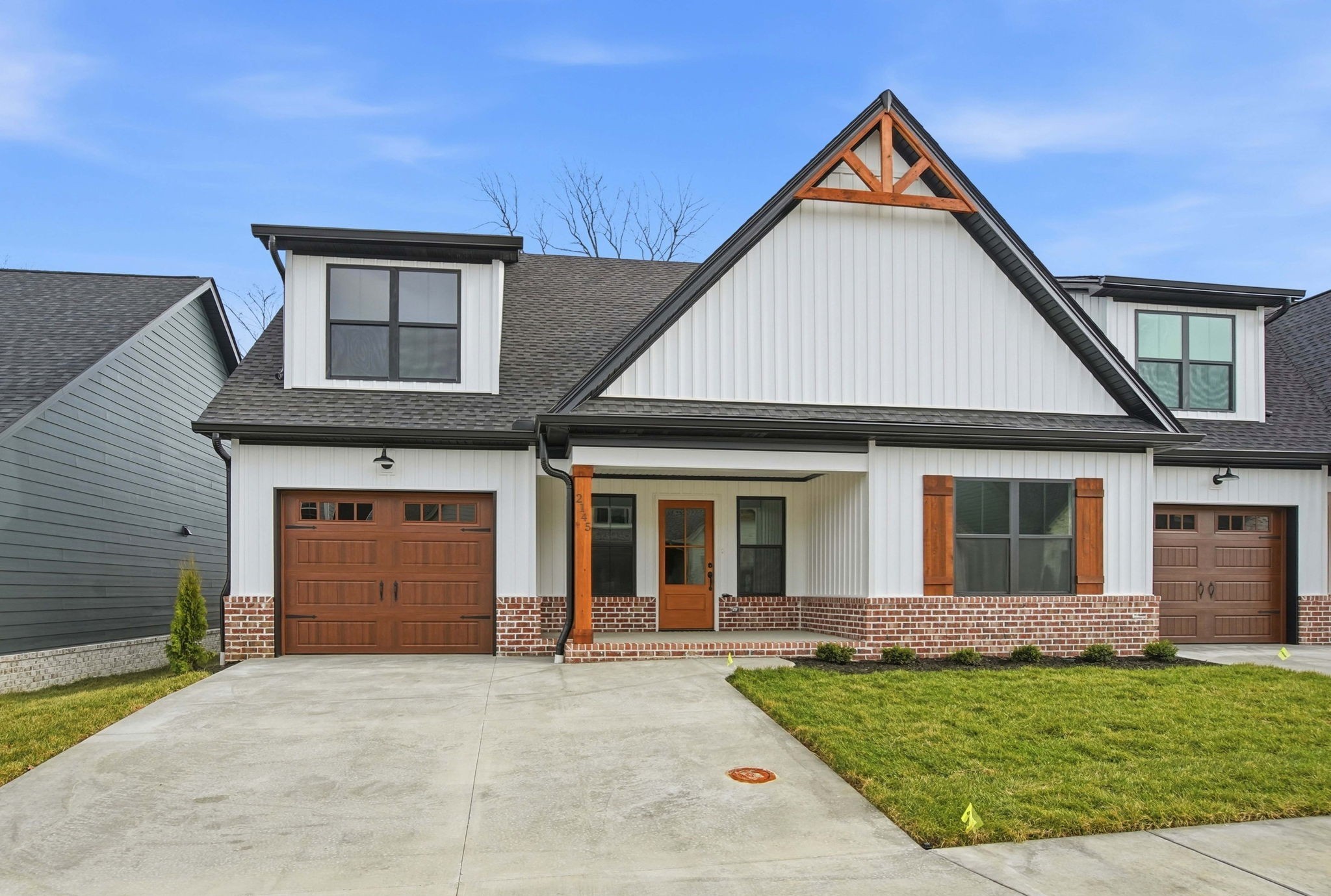 2139 Rylee Way, Unit 6 Greenbrier, TN 37073 - Photo 4 of 32 a front view of a house with a yard and garage