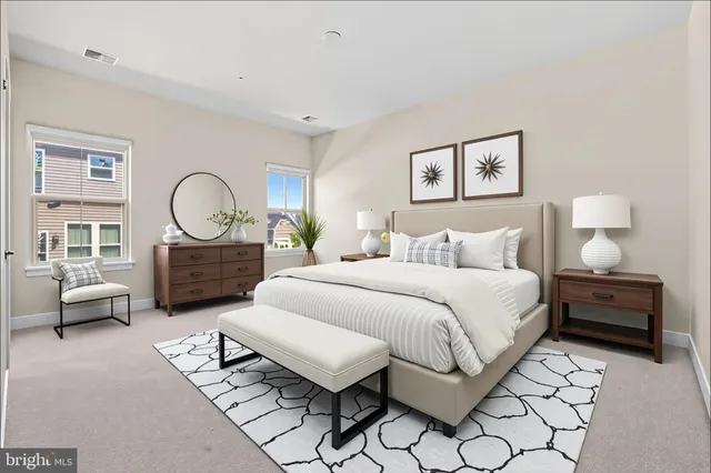 a bedroom with a bed and glass door