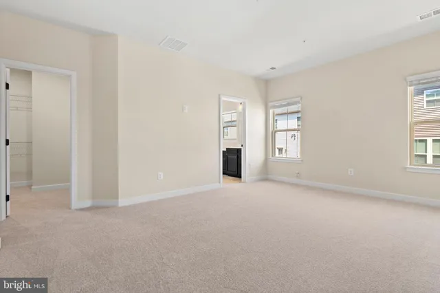 a view of empty room with windows