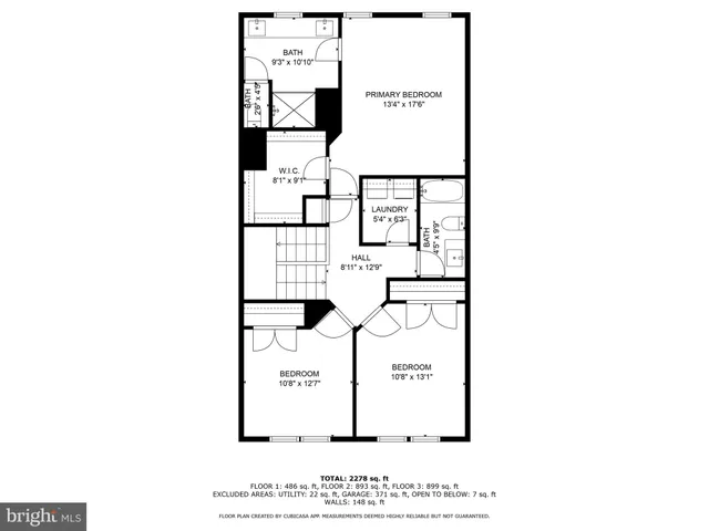 a picture of a bench in front of a wall