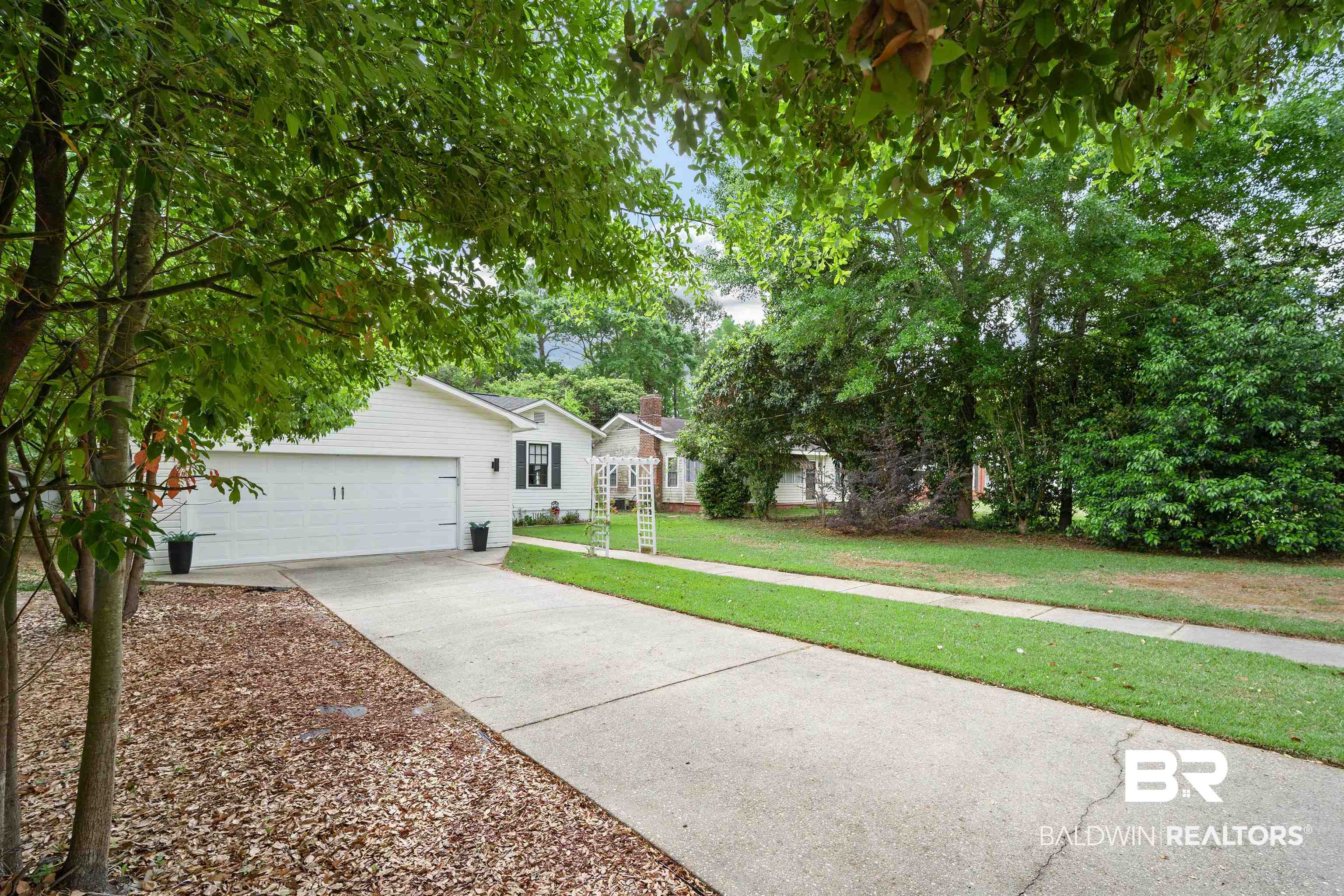 103 Emogene Place Mobile, AL 36606 - Photo 4 of 32 View of front of house with a front lawn and concrete driveway