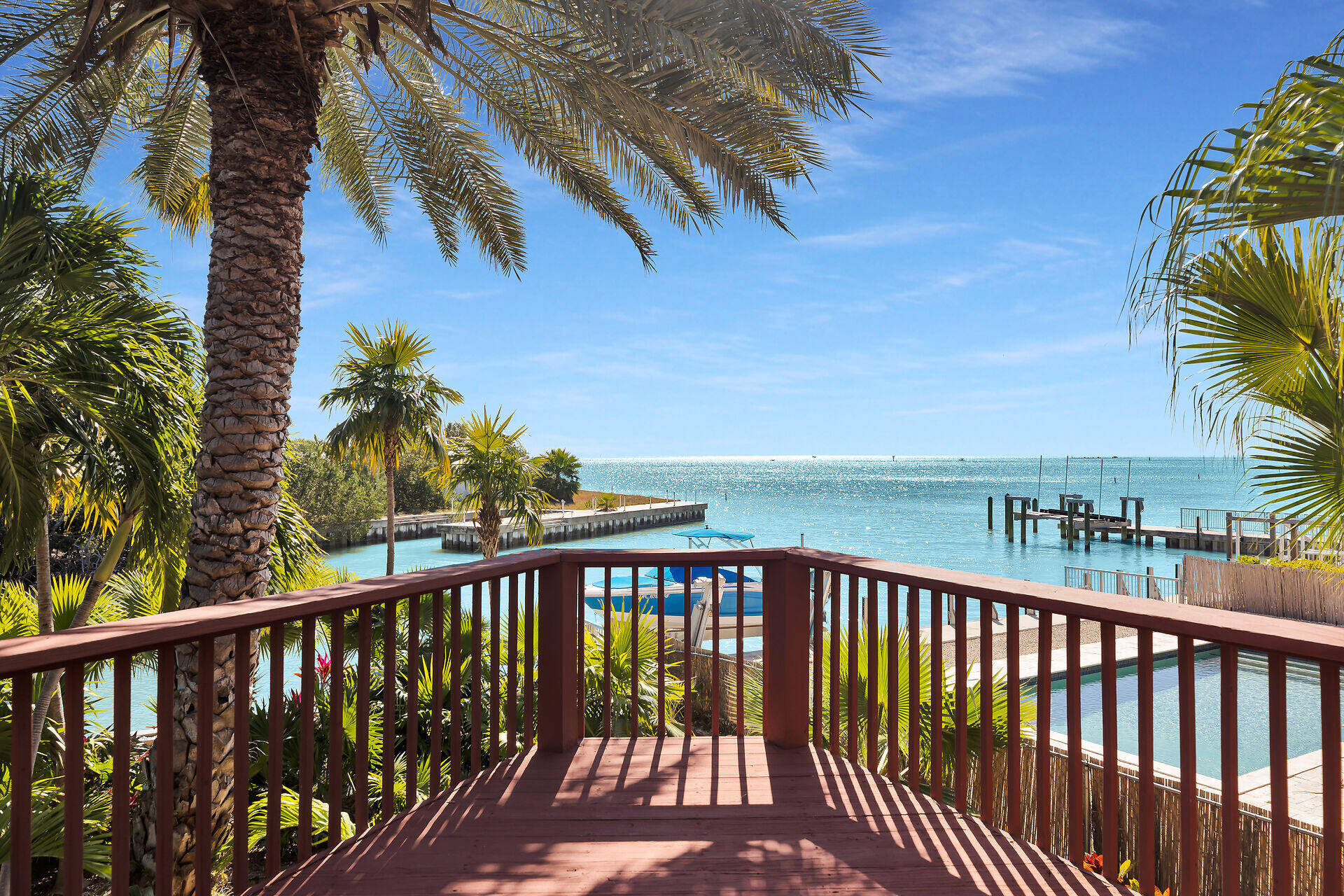 42 Treasure Road Marathon, FL 33050 - Photo 1 of 70 a view of a balcony with wooden floor and fence