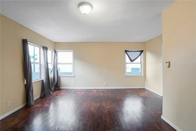 a kitchen with sink a refrigerator and cabinets