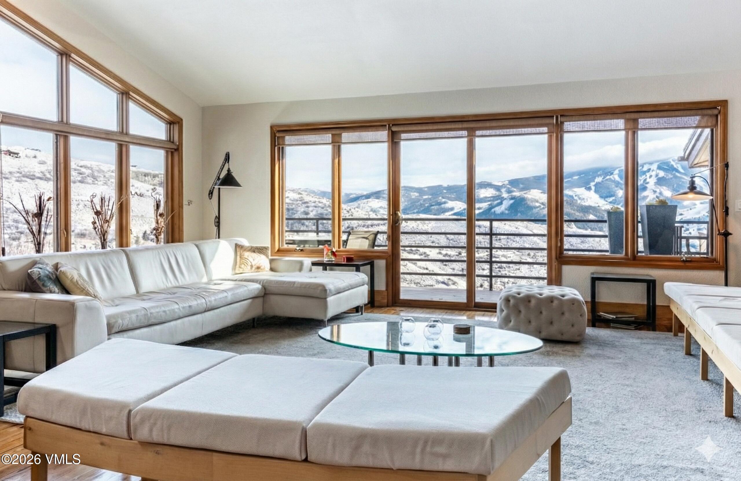 3016 Wildridge Road, Unit 6 Avon, CO 81620 - Photo 1 of 37 a living room with furniture and a large window
