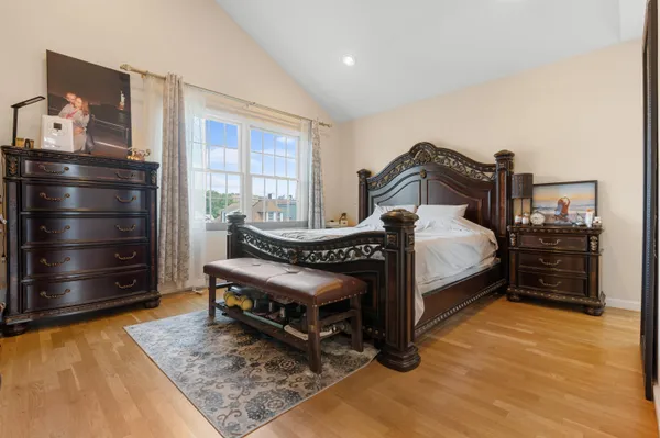 a bedroom with a bed and a dresser