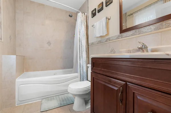 a bathroom with a toilet a sink and bathtub