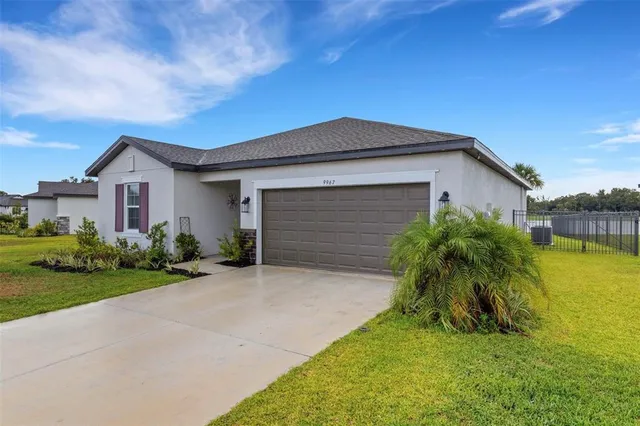 a front view of house with yard and green space