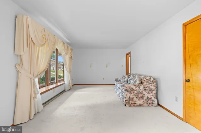 a kitchen with a sink appliances and cabinets