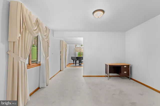 a kitchen with stainless steel appliances granite countertop a refrigerator a oven and a sink