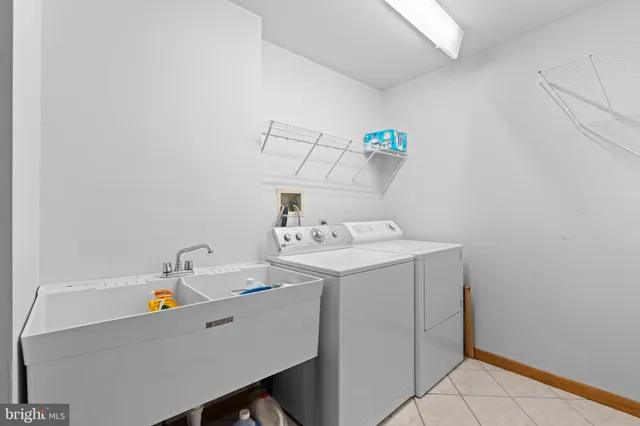 a living room with furniture and large windows