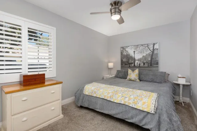 a bedroom with a bed and window