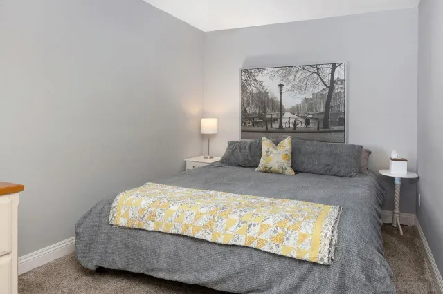 a bedroom with bed and window