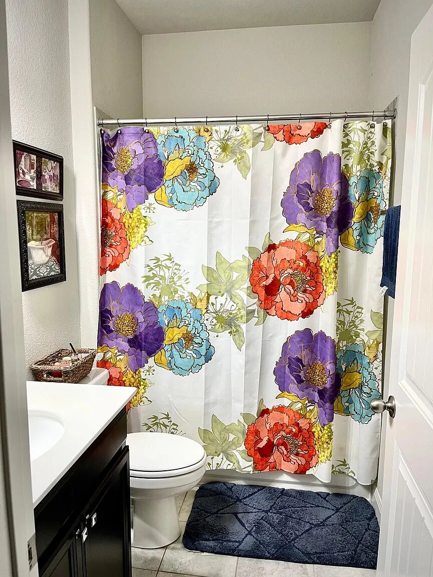 4221 Borho Ranch Street Leander, TX 78641 - Photo 12 of 16 Bathroom featuring a vanity with a white countertop and dark cabinetry, a toilet, and light-colored tiled flooring
