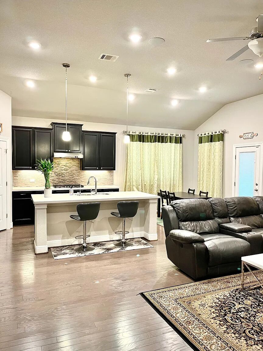 4221 Borho Ranch Street Leander, TX 78641 - Photo 15 of 16 This open-concept living area features rich hardwood flooring and recessed lighting throughout