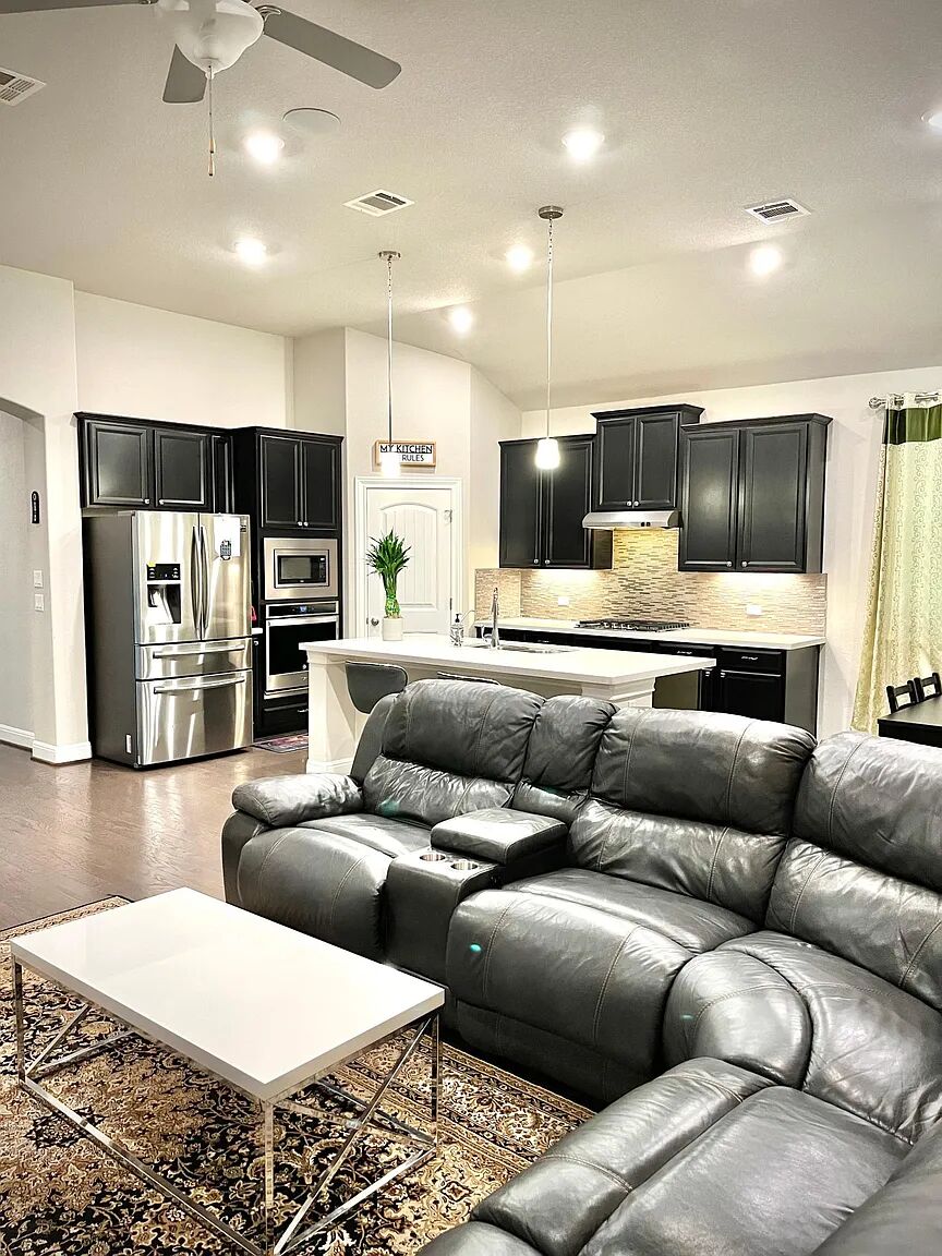 4221 Borho Ranch Street Leander, TX 78641 - Photo 3 of 16 Open-concept living space featuring recessed lighting, a ceiling fan, and hardwood flooring