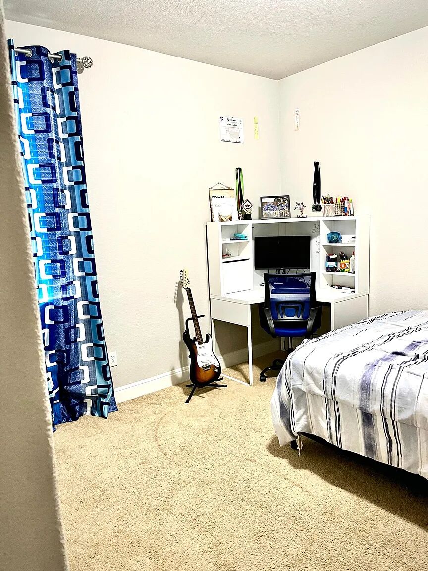 4221 Borho Ranch Street Leander, TX 78641 - Photo 5 of 16 The room features light-colored walls and carpet flooring