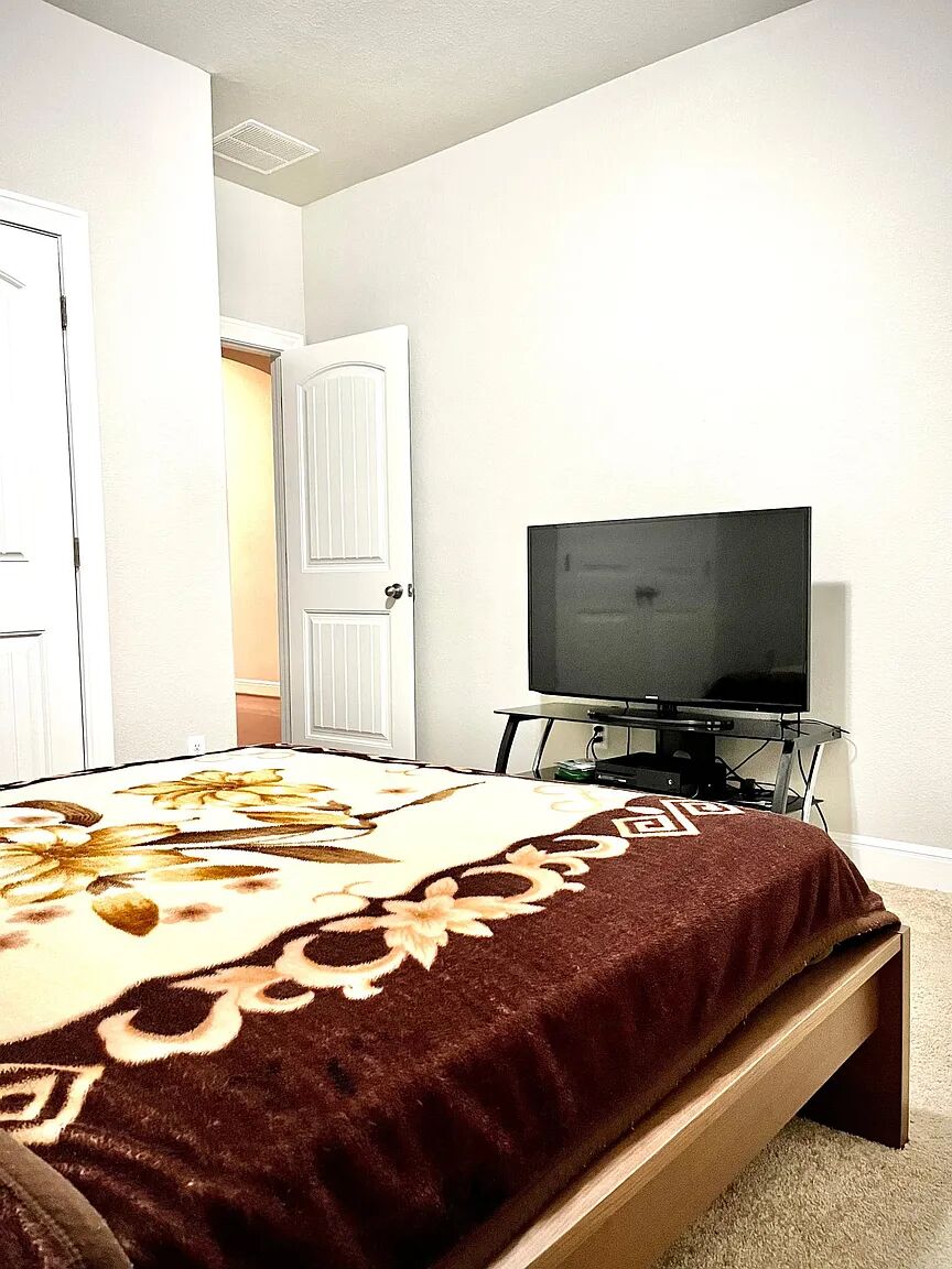 4221 Borho Ranch Street Leander, TX 78641 - Photo 10 of 16 The room features neutral-toned walls, carpeted flooring, and a white paneled door