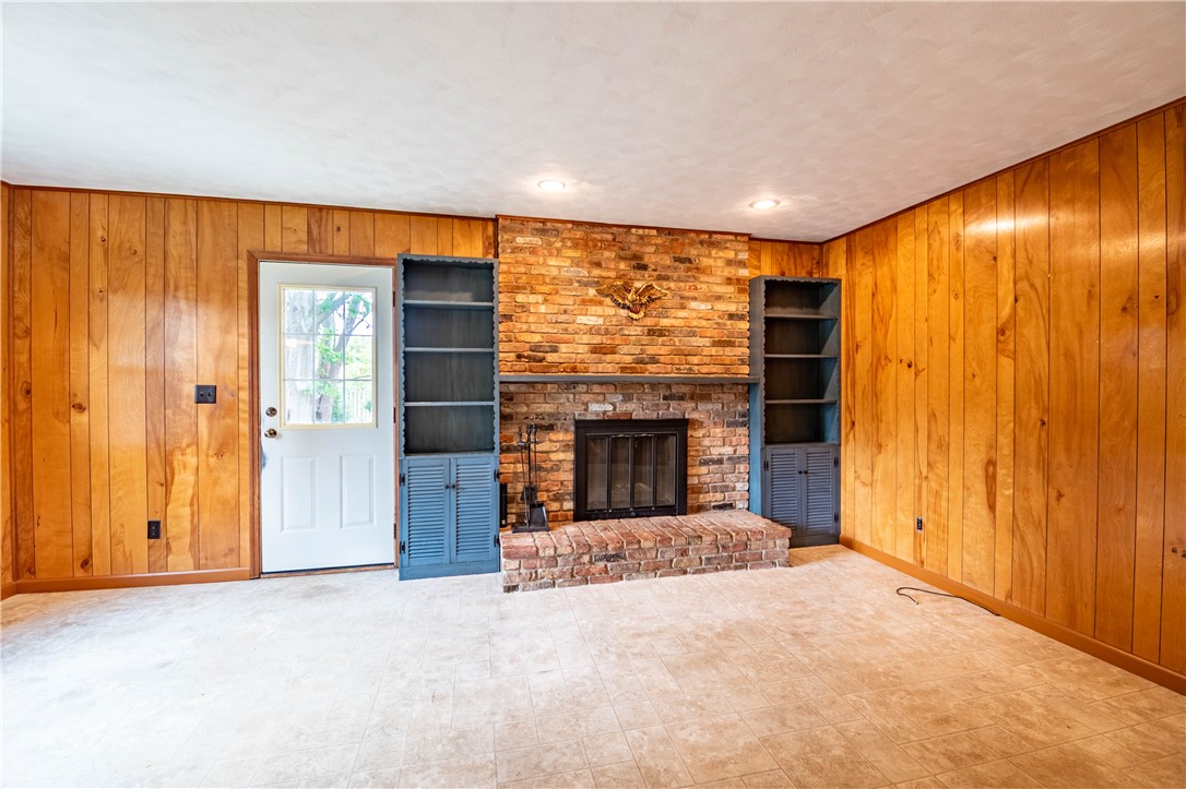 365 West Ash Avenue Decatur, IL 62526 - Photo 14 of 32 an empty room with a fireplace and painted walls