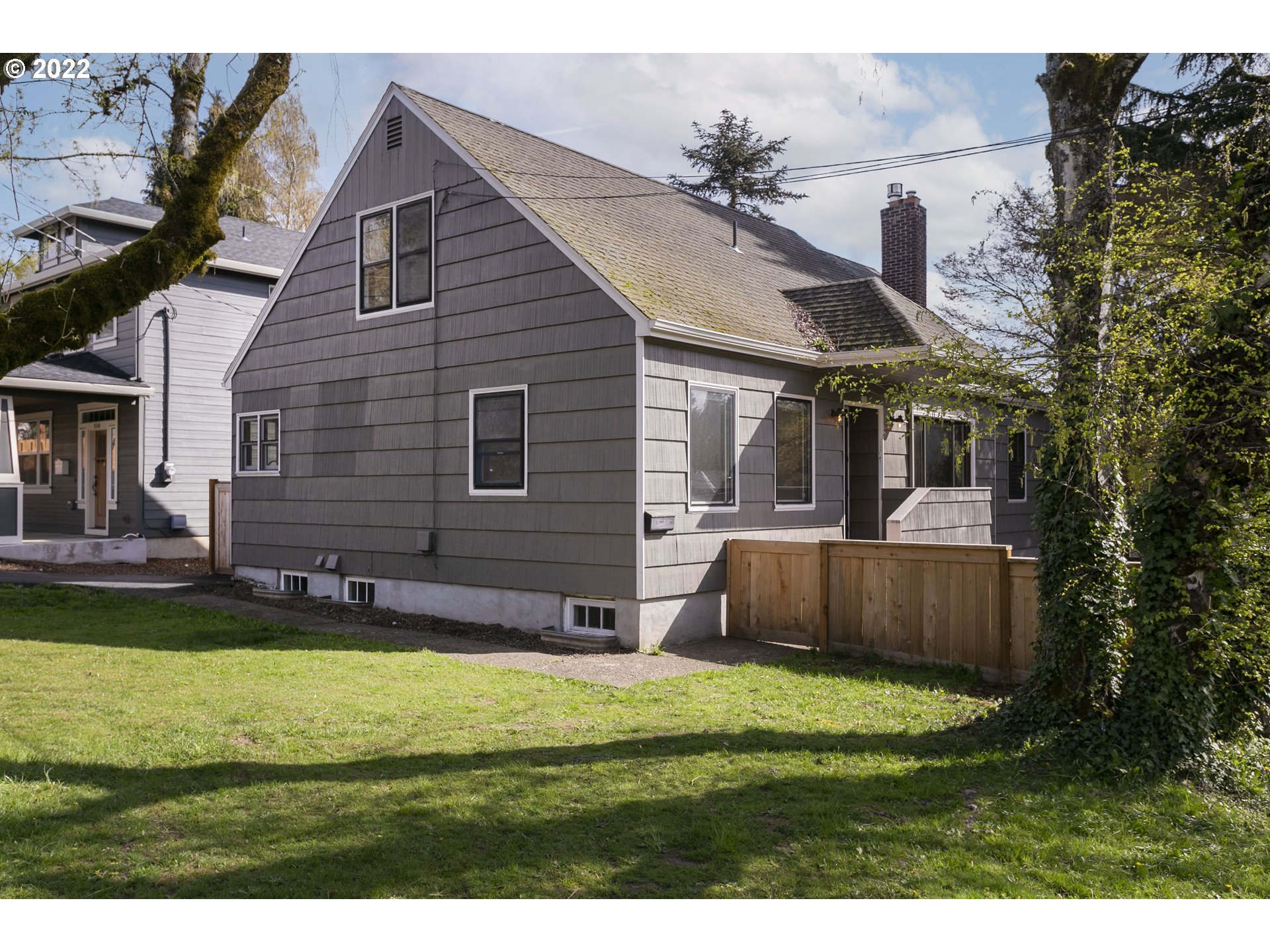 225 Southwest Carson Street Portland, OR 97219 - Photo 1 of 32 a view of a house with a backyard