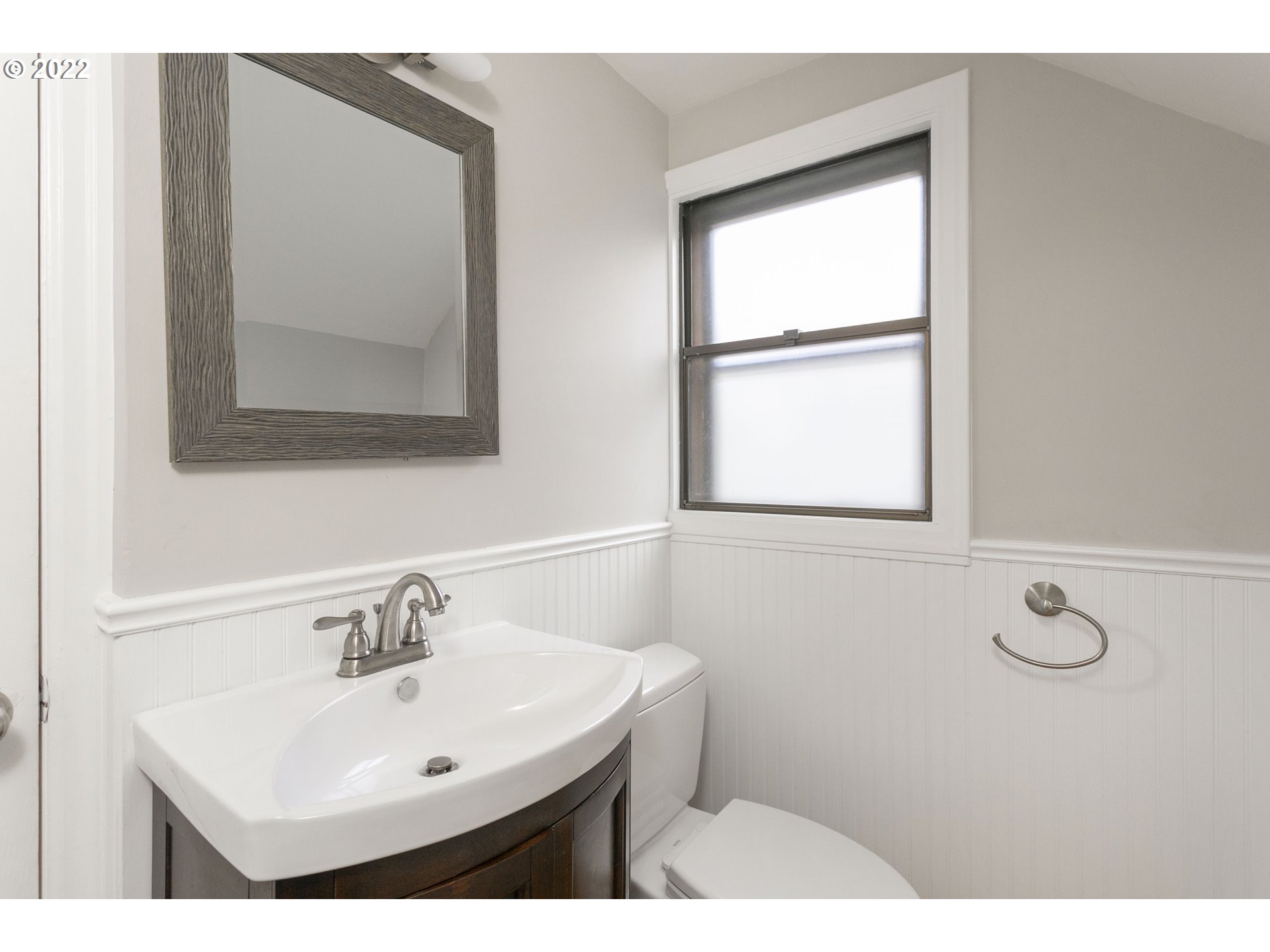 225 Southwest Carson Street Portland, OR 97219 - Photo 18 of 32 a bathroom with a sink and a mirror