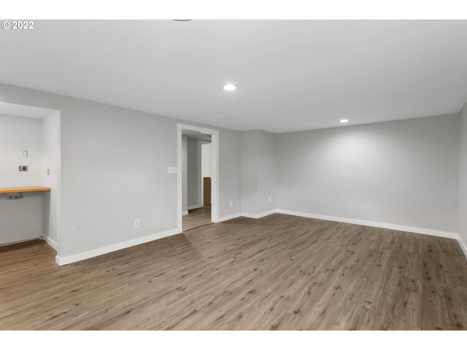225 Southwest Carson Street Portland, OR 97219 - Photo 25 of 32 a view of an empty room with wooden floor