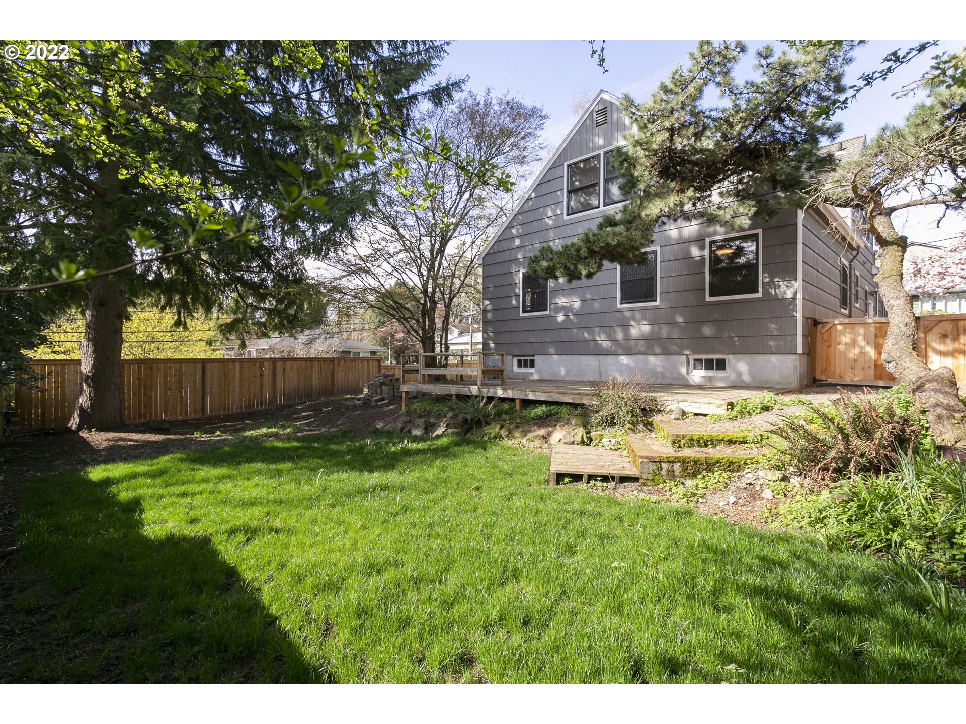 225 Southwest Carson Street Portland, OR 97219 - Photo 28 of 32 a view of a house with a yard