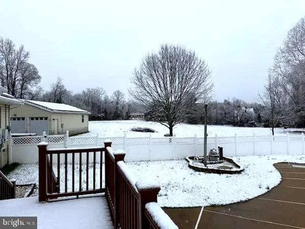 a view of a swimming pool and a yard