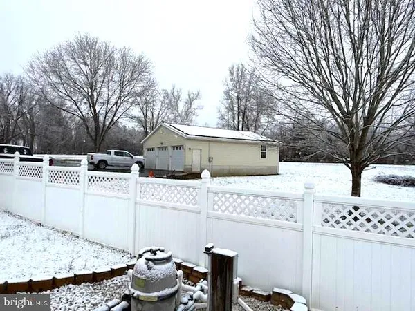 a view of a swimming pool with a yard
