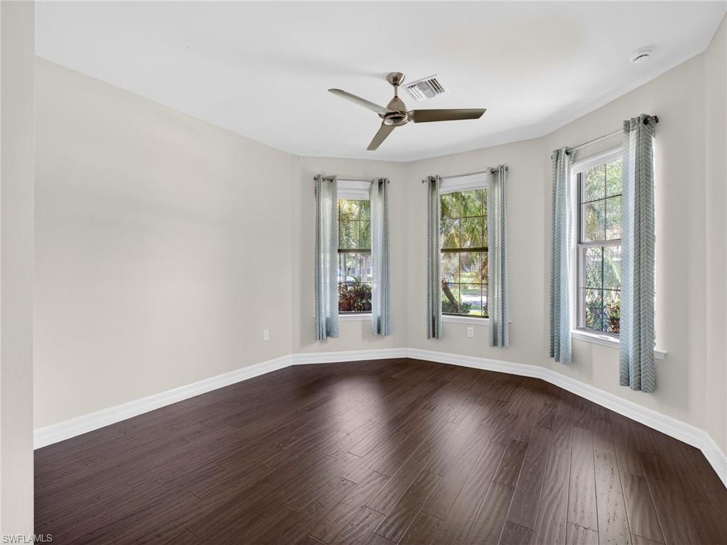 6124 Victory Drive Ave Maria, FL 34142 - Photo 31 of 50 a view of an empty room with wooden floor and a window