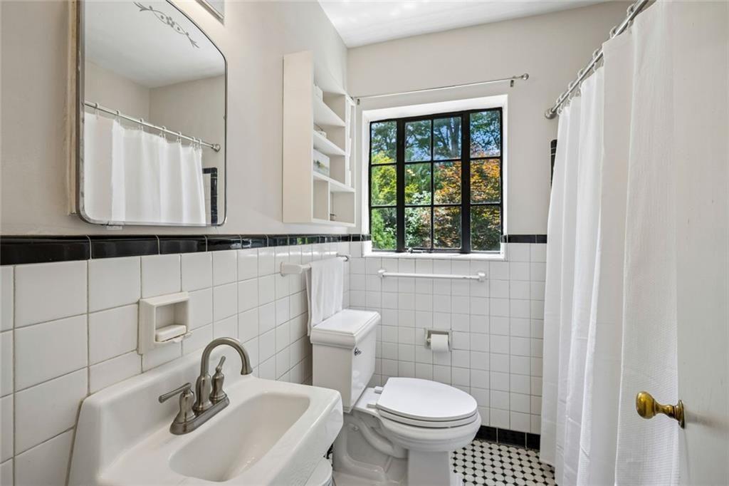 2069 Edinburgh Terrace Northeast Atlanta, GA 30307 - Photo 26 of 72 a bathroom with a sink and a toilet