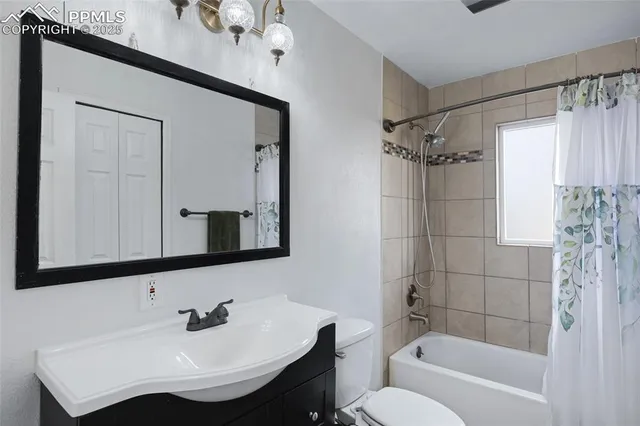 a bathroom with a sink a toilet and bathtub