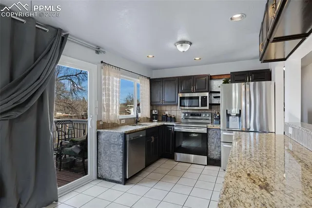 a view of a roof deck with wooden fence