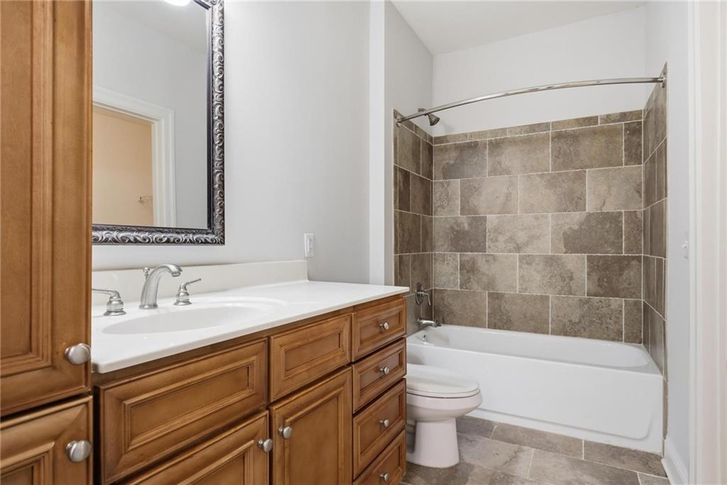 901 Abernathy Road Northeast, Unit 3080 Atlanta, GA 30328 - Photo 14 of 21 a bathroom with a sink a toilet and shower
