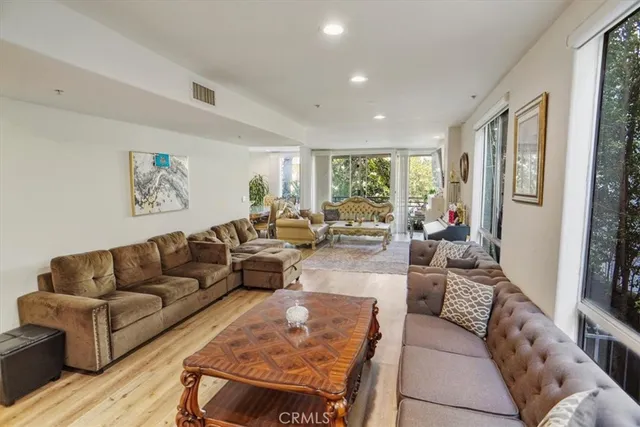 a kitchen with a stove and white cabinet