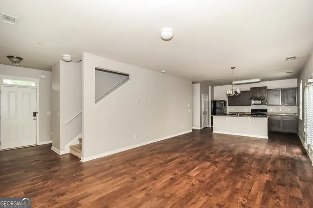 a view of kitchen with wooden floor