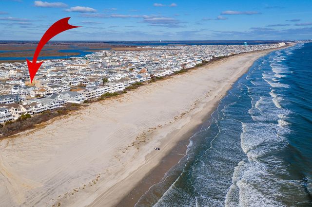 an aerial view of beach and ocean