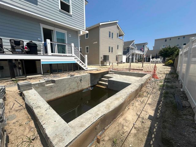 a view of a house with swimming pool