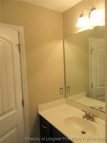 a bathroom with a sink and shower