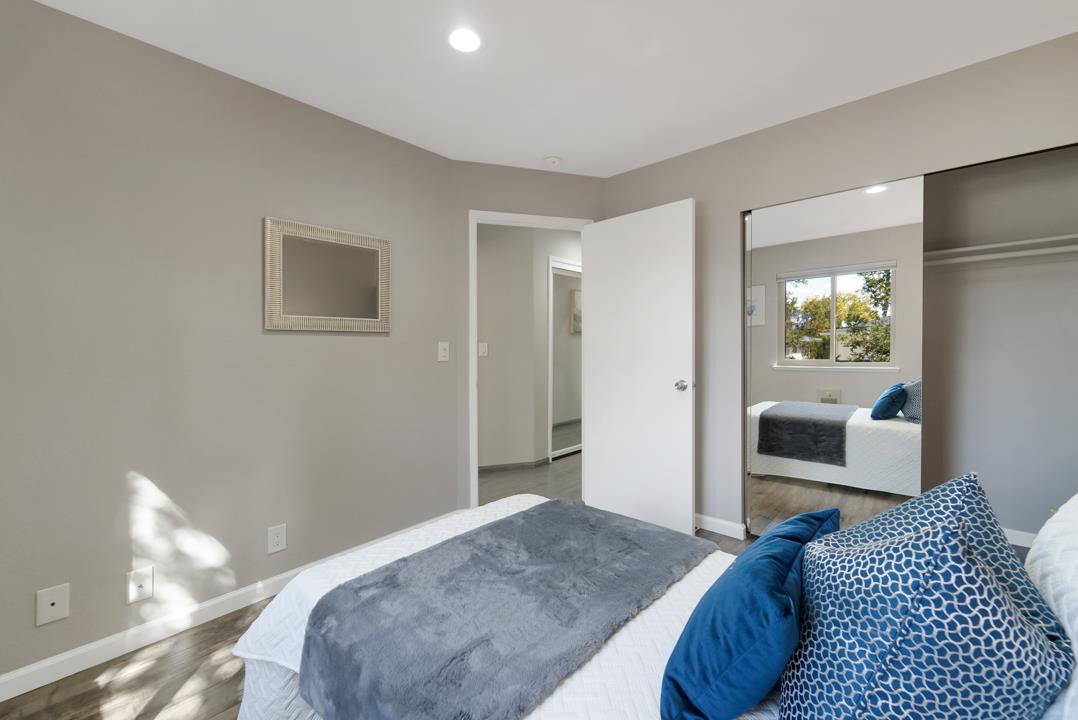 2865 South Bascom Avenue, Unit 902 San Jose, CA 95124 - Photo 17 of 29 a bedroom with a bed and glass door