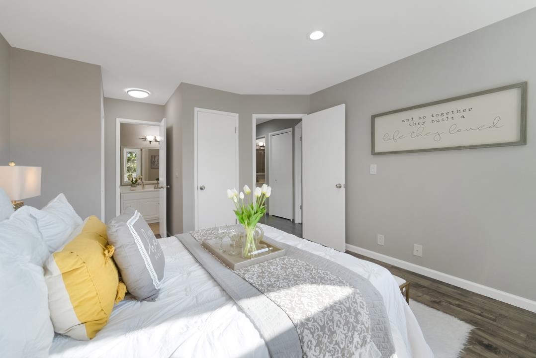 2865 South Bascom Avenue, Unit 902 San Jose, CA 95124 - Photo 19 of 29 a bedroom with a bed and hallway